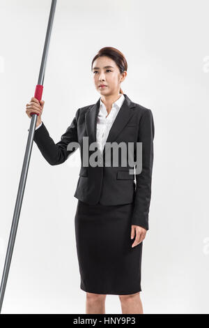 Businesswoman with javelin Banque D'Images