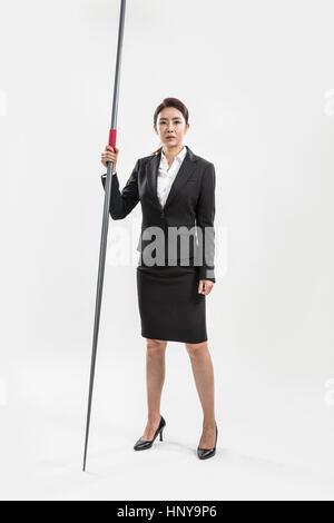 Businesswoman with javelin Banque D'Images