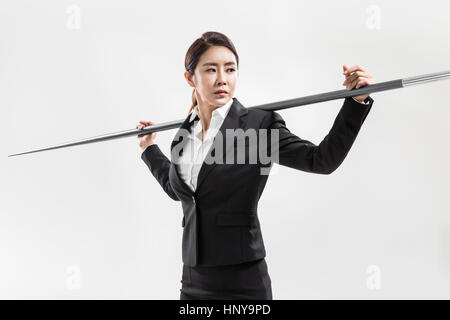 Businesswoman with javelin Banque D'Images