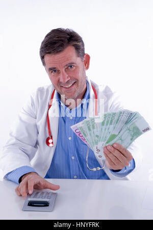 Modèle libération , Symbolbild aerztegehalt - médecin avec de l'argent Banque D'Images