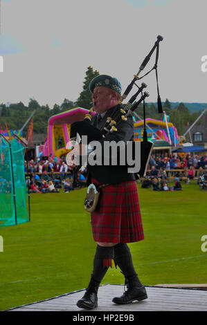 Piper au Highland Games Banque D'Images