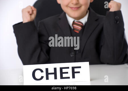 Parution du modèle, Symbolbild Juniorchef jubelt - symbolique pour chef junior Banque D'Images