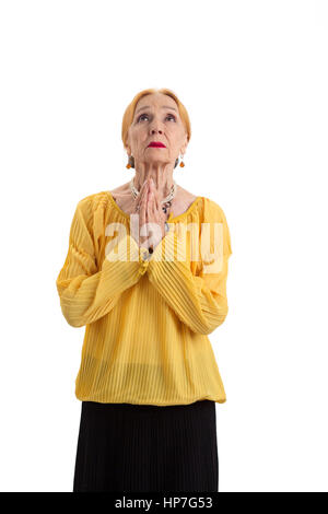 Femme en prière personnes âgées isolées. Jusqu'à la vieille dame. L'espoir d'un miracle. Banque D'Images