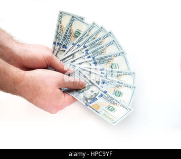 Man holding cent billets d'un dollar sont dispersés sur un fond blanc Banque D'Images