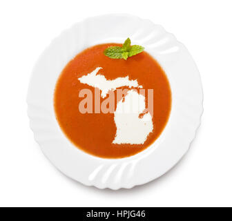 La plaque d'une soupe de tomate avec la crème dans la forme du Michigan.(série) Banque D'Images