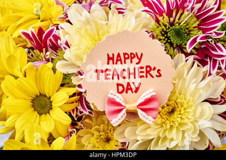 Fleurs et Teacher's Day Card. Félicitation à jour des connaissances. Banque D'Images