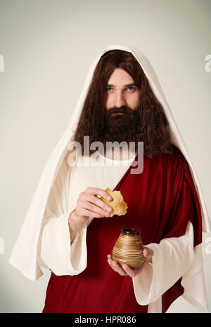 Jésus avec cruche de vin et morceau de pain Banque D'Images