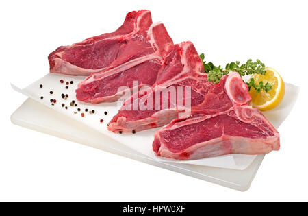 T-bone steaks sur une planche à découper Banque D'Images