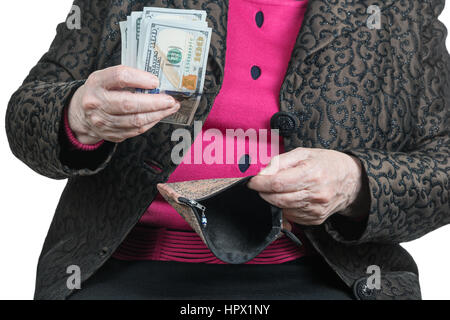 Senile hands holding dollars pack et vide sac à main Banque D'Images