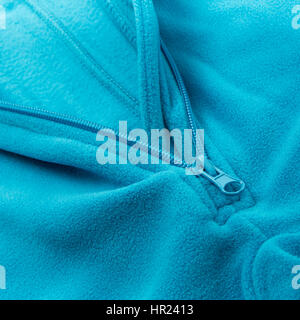 Close up fermeture éclair sur un fond bleu fleece Banque D'Images