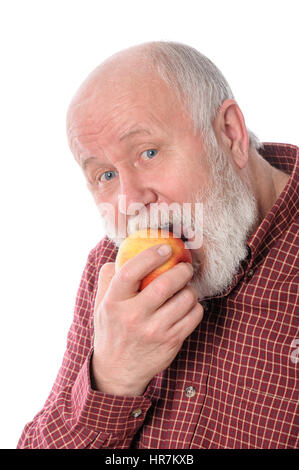 Man souriant manger la pomme, isolated on white Banque D'Images