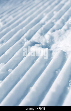 Vide damée piste de ski, snow texture velours côtelé avec selective focus Banque D'Images