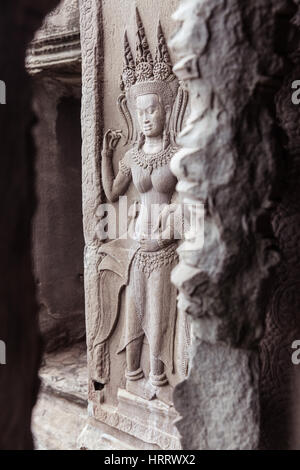 Siem Reap, Cambodge - 25 juin 2014 : Bas-reliefs sur le mur de l'ancien temple d'Angkor Wat, Siem Reap, Cambodge le 25 juin, 2014. Banque D'Images