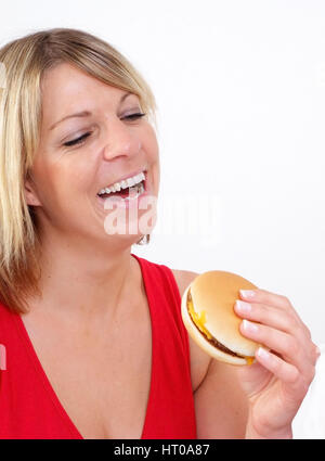 Junge Frau mit Burger - Femme avec burger Banque D'Images