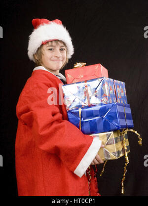 Kleiner Weihnachtsmann mit Geschenken - Petit Père Noël avec des cadeaux Banque D'Images