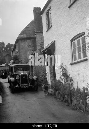 1931 Austin 16/6 sur un essai routier. Artiste : Bill Brunell. Banque D'Images