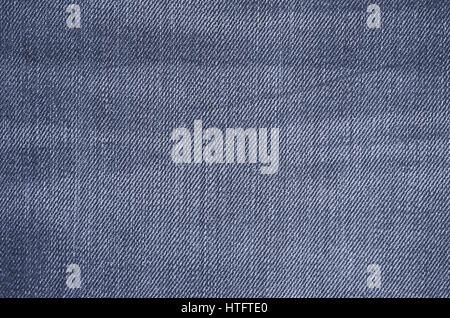La texture de jeans bleu près du textile. Toile vierge pour la conception. Jeu de fond multicolore. Banque D'Images