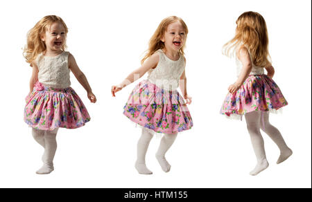 Cute little girl jumping with joy isolé sur fond blanc Banque D'Images