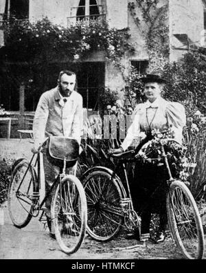 Marie (1867-1934) et Pierre Curie (1859-1906) photographié au début de leur vie de couple lorsqu'ils bénéficient à vélo dans la campagne française. Banque D'Images