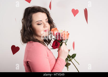 Woman holding roses Banque D'Images