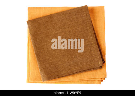 Deux serviettes de table textiles, marron et orange, on white Banque D'Images