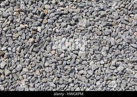 Gravier de granit de macadam, de roche concassée gris pour la construction sur le sol d'éboulis, texture background Banque D'Images