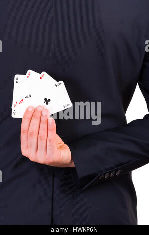 Businessman holding cartes à jouer derrière son dos. Banque D'Images