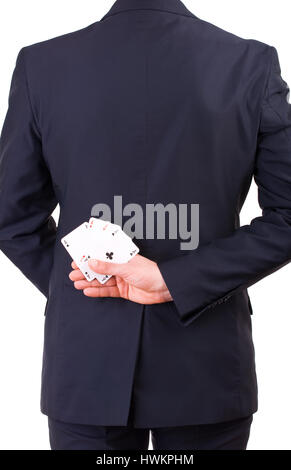 Businessman holding cartes à jouer derrière son dos. Banque D'Images