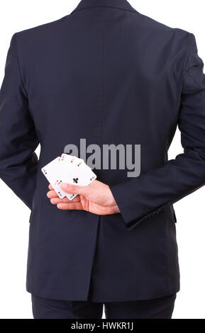 Businessman holding cartes à jouer derrière son dos. Banque D'Images