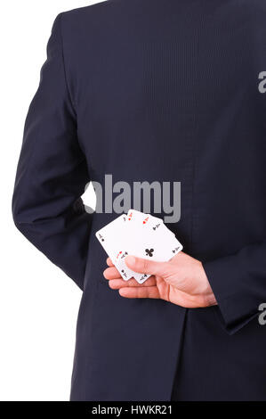 Businessman holding cartes à jouer derrière son dos. Banque D'Images