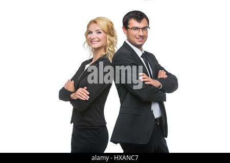 Belle Dame d'affaires et handsome businessman standing back to back. En regardant la caméra. Isolé sur fond blanc. Copier l'espace. Banque D'Images