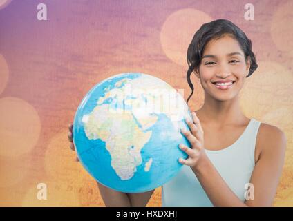 Digital composite of Woman with globe contre plan avec bokeh Banque D'Images