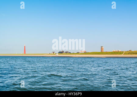 Leuchtturm Lange Jaap à côte de la mer du Nord de Huisduinen près de Den Helder, aux Pays-Bas Banque D'Images