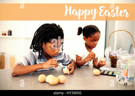 Logo Joyeuses pâques oeufs peinture frères concentrés contre Banque D'Images