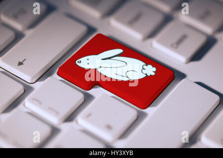 PE047   01 Pâques bs nf contre la clé rouge sur le clavier Banque D'Images