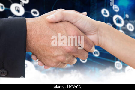 Image composite de man shaking hands with partner Banque D'Images