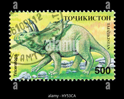 Le Tadjikistan de timbre-poste représentant un dinosaure triceratops Banque D'Images