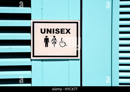 Signe unisexe est affiché à l'extérieur d'une toilette publique porte. Banque D'Images