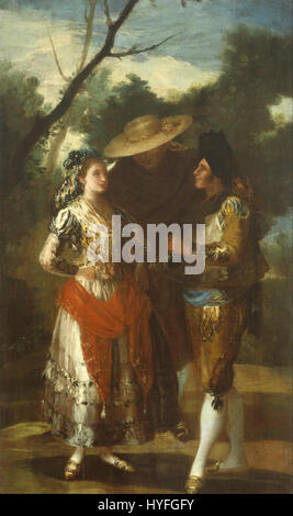 Une Maja avec deux toreros, attribuée à un disciple de Francisco Goya, représente une femme espagnole, connue sous le nom de « maja », avec deux toreros, capturant l'essence de la culture espagnole du XVIIIe siècle et l'art de la corrida. Banque D'Images