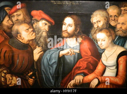 'Christ et l'Adulteress' de Lucas Cranach l'ancien, logé au Musée des Beaux-Arts de Budapest, représente la scène biblique du Christ intervenant dans le jugement d'une adultère. L'œuvre met en valeur le style caractéristique de Cranach, aux couleurs vives et à l'expression émotionnelle. Banque D'Images