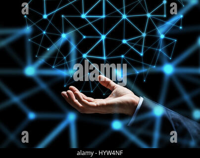 Close up of businessman hand avec hologramme Banque D'Images