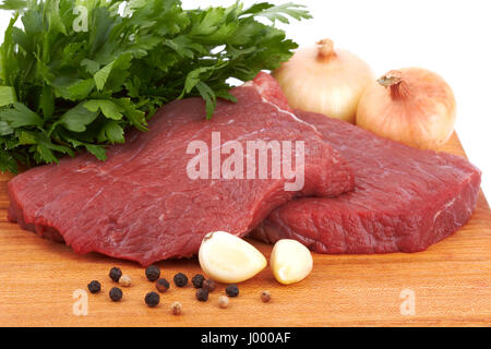 Couper de la viande sur un panneau Banque D'Images