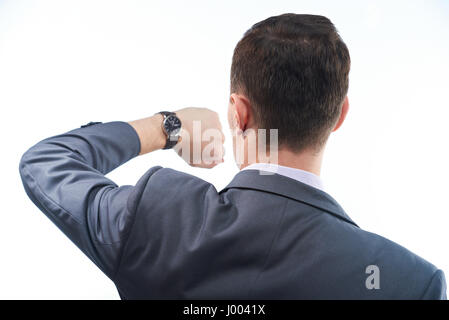 L'homme d'affaires avec watch vue depuis l'arrière. Man in suit vérifier quelle heure il est. Banque D'Images