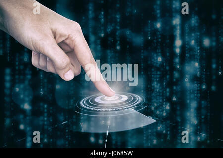 Main pointant sur fond blanc contre la molette du volume de l'interface Banque D'Images