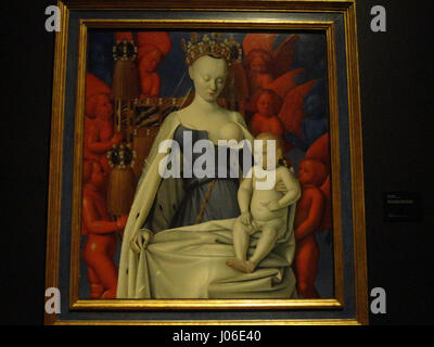 Le tableau de Jean Fouquet 'Madone entourée de séraphins et de chérubins' met en scène la Vierge Marie entourée d'anges dans une représentation sereine et sacrée. L’œuvre met en évidence la maîtrise de Fouquet dans le rendu des figures divines et des êtres célestes dans un contexte de dévotion. Banque D'Images