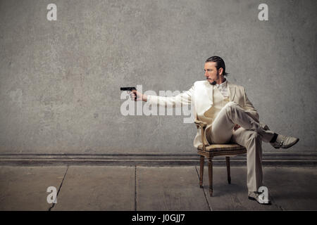 Businessman with gun Banque D'Images