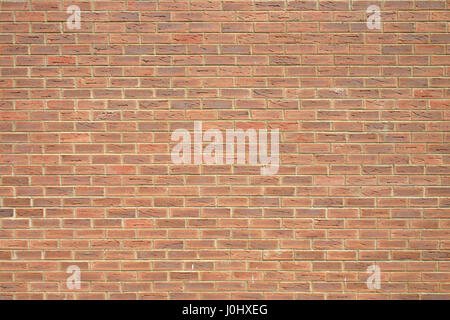La construction d'un mur de brique démontrant d'un certain nombre de types de mur de brique rouge à brun-jaune et blanc Banque D'Images