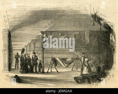 1854, gravure ancienne 'Vue de l'intérieur de l'arsenal de l'État de New York." L'Arsenal est un bâtiment en brique symétrique avec peu de détails néo-gothique, situé dans Central Park, New York City, centré sur la 64ème Street, près de la Cinquième Avenue. Construit entre 1847 et 1851 comme un entrepôt d'armes et de munitions pour la milice de l'État de New York. SOURCE : gravure originale. Banque D'Images