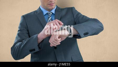 Digital composite de Midsection of businessman checking time Banque D'Images