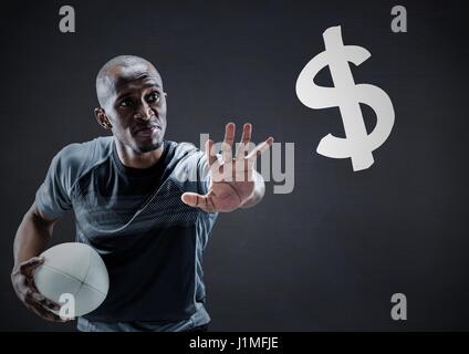 Joueur de rugby avec la main vers le signe du dollar contre tableau marine Banque D'Images